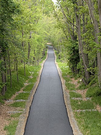 Mass Central Rail Trail showing a restored stone arch bridge