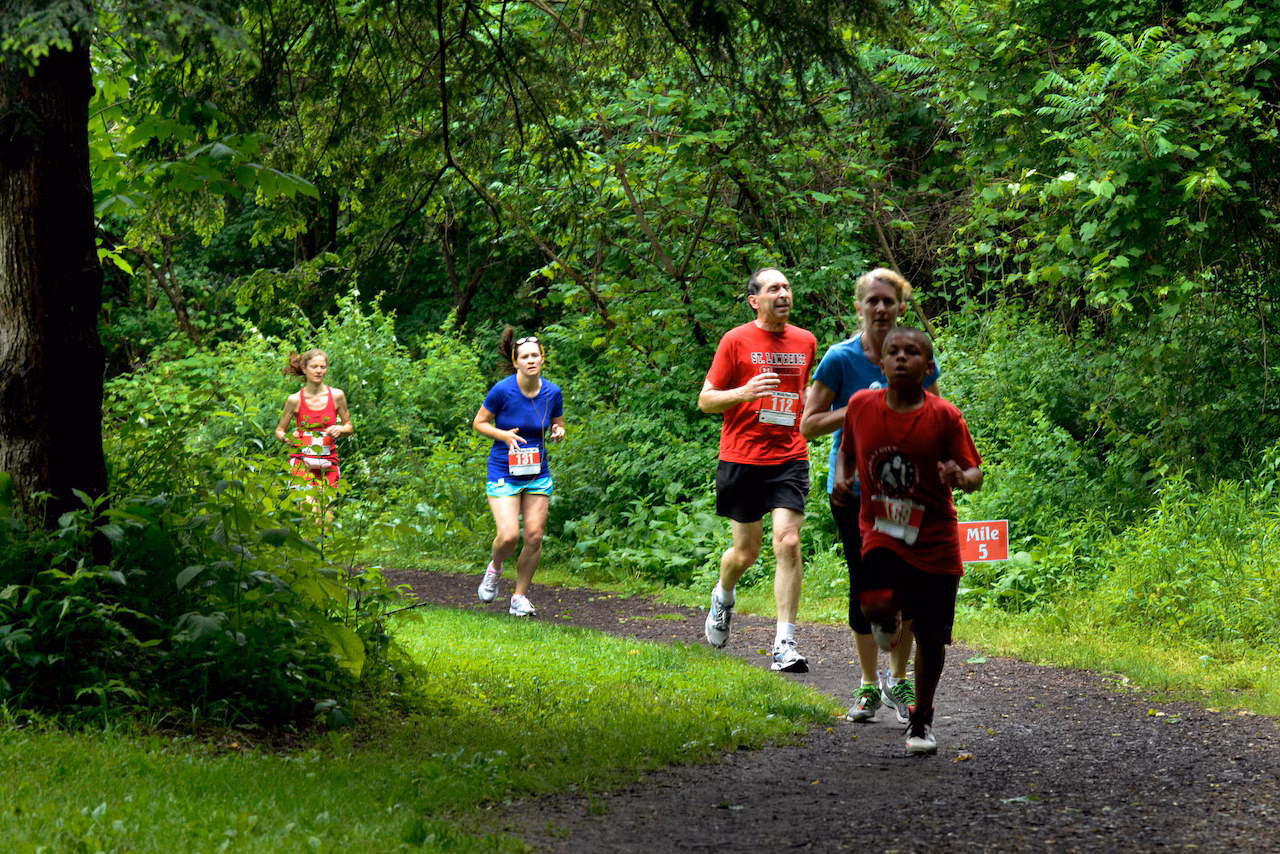 Runner on the Loop the Lake trail at Onondaga Lake Park in Syracuse NY