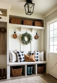 Mudroom entryway drop zone with tile flooring and drainage setups