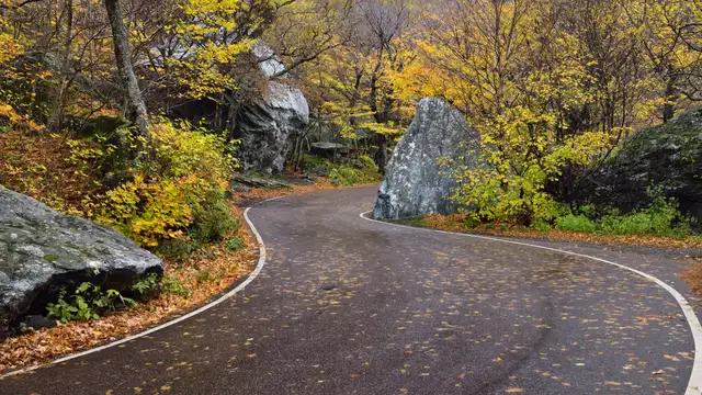 Smugglers Notch narrow mountain pass road twisting between giant boulders